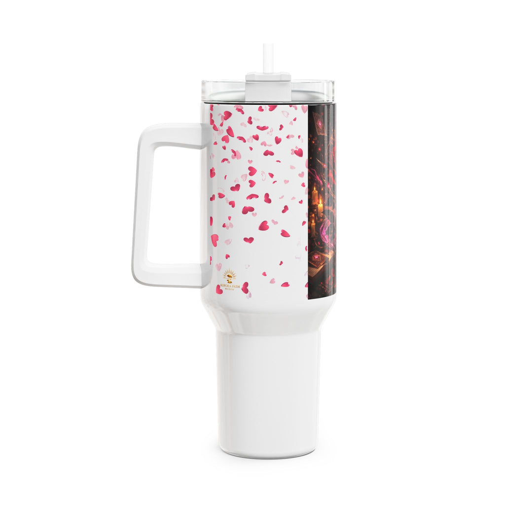 White travel mug with pink heart pattern on a white background