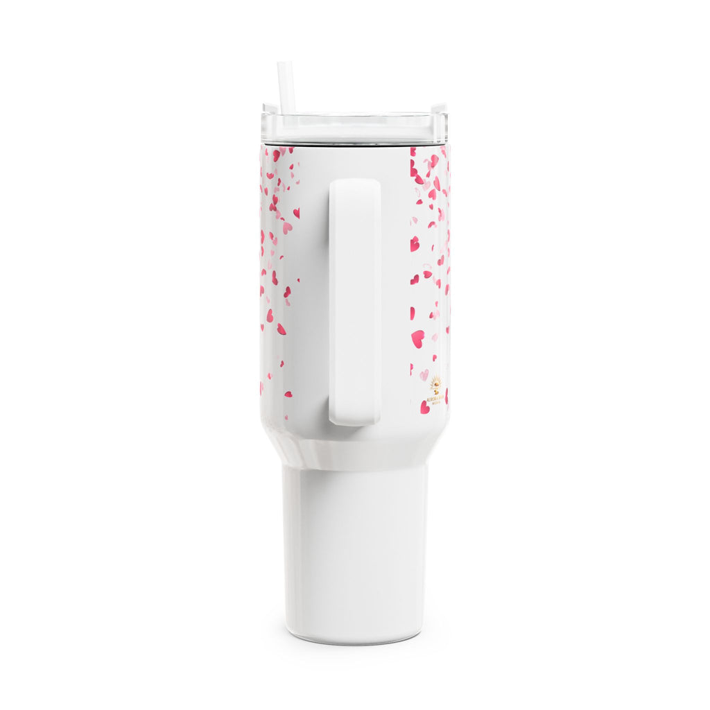 White tumbler with pink speckles on a white background