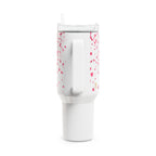 White tumbler with pink speckles on a white background